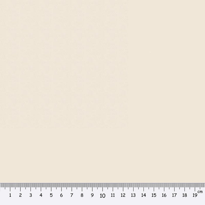 Light beige fabric swatch with a ruler at the bottom for scale.