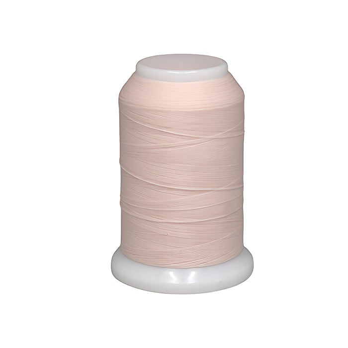 Spool of pale pink woolly nylon thread.