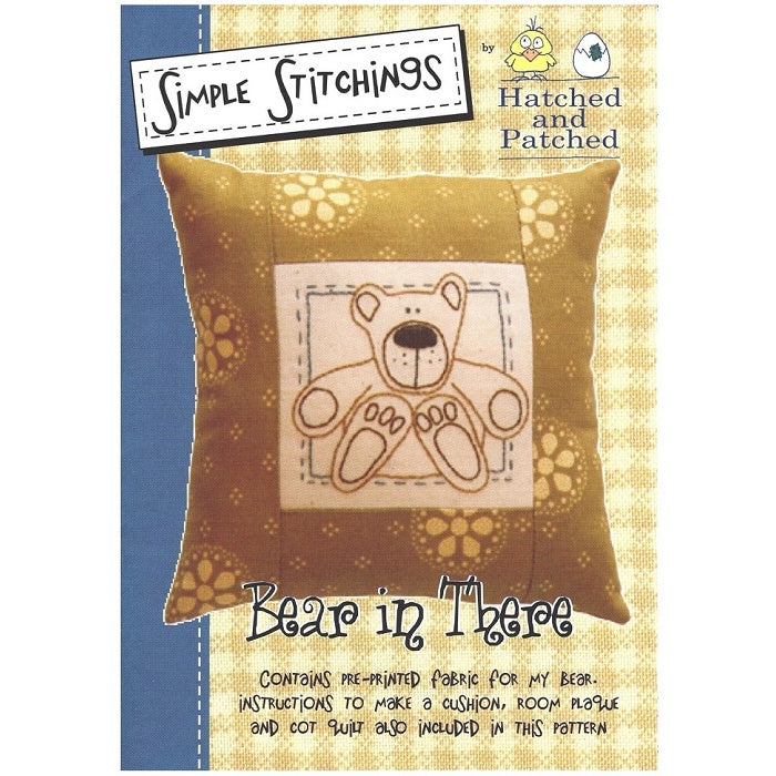 Pattern cover of embroidered cushion with cute seated bear.