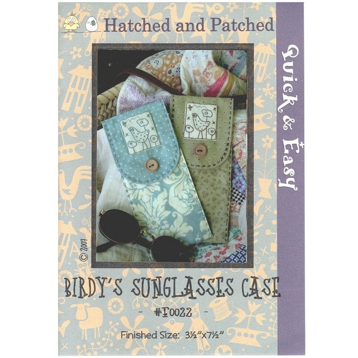 Pattern cover of sunglasses case with bird and flower applique.
