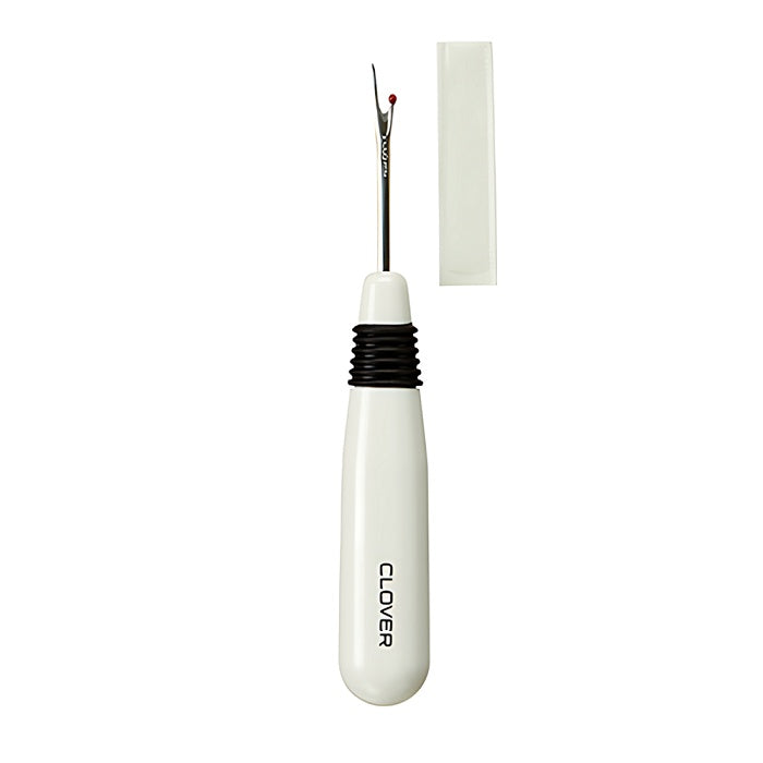 White handled seam ripper with Clover branding.