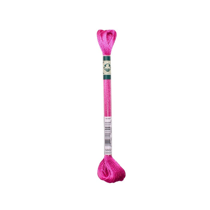 Skein of fuschia embroidery floss with DMC branding.