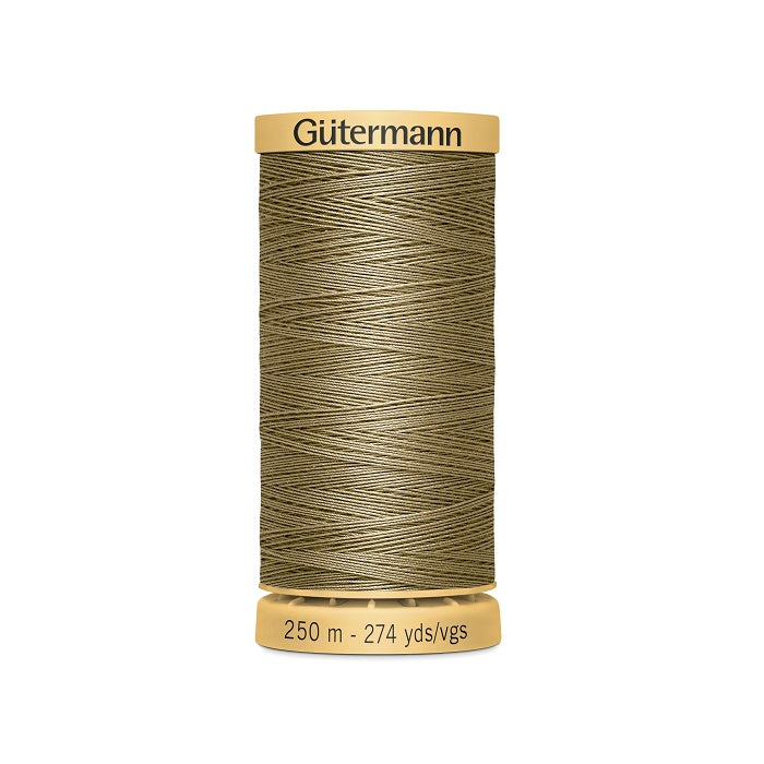 Spool of brown cotton thread with Gutermann branding.