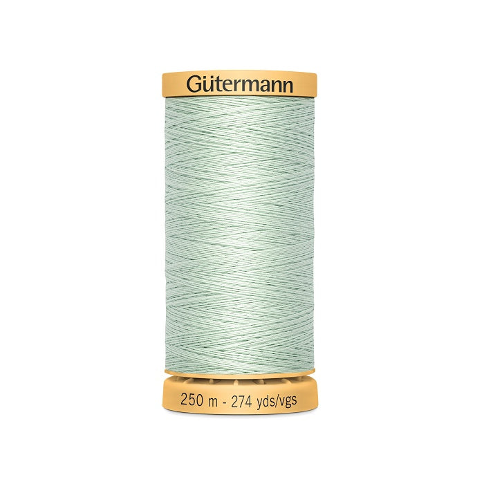 Spool of light pale green cotton thread with Gutermann branding.