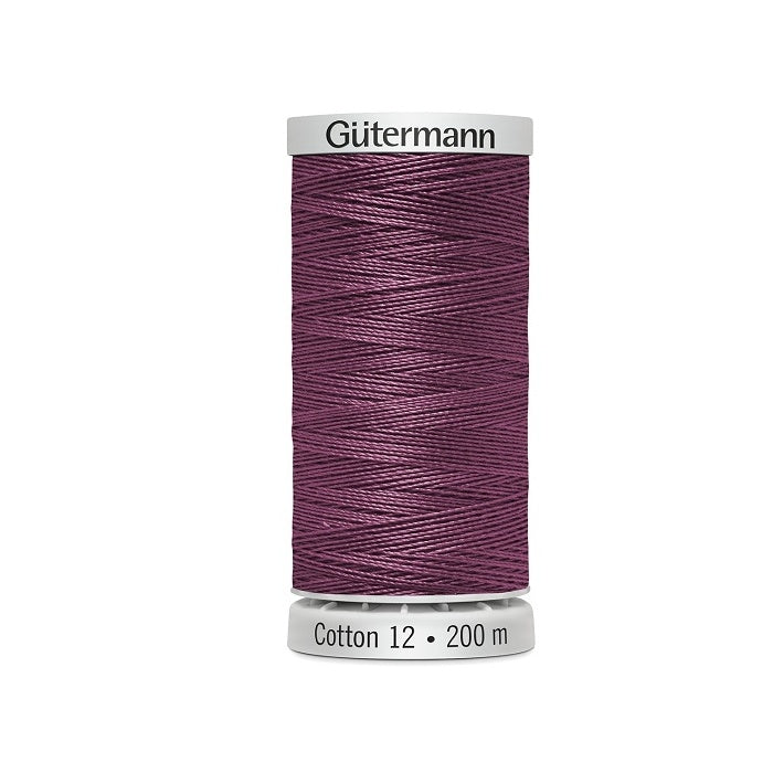 Spool of pinkish mauve thread with Gutermann Cotton 12 branding.
