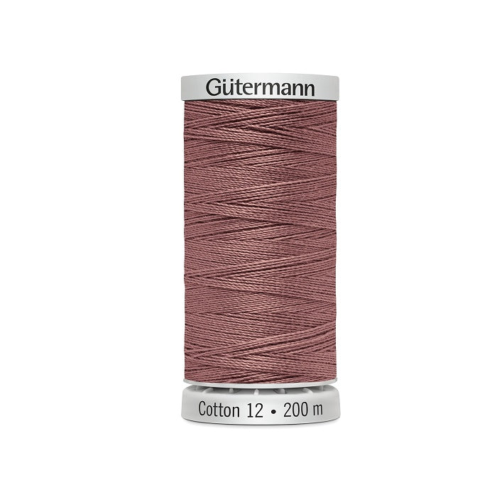Spool of dark shell pink thread with Gutermann Cotton 12 branding.