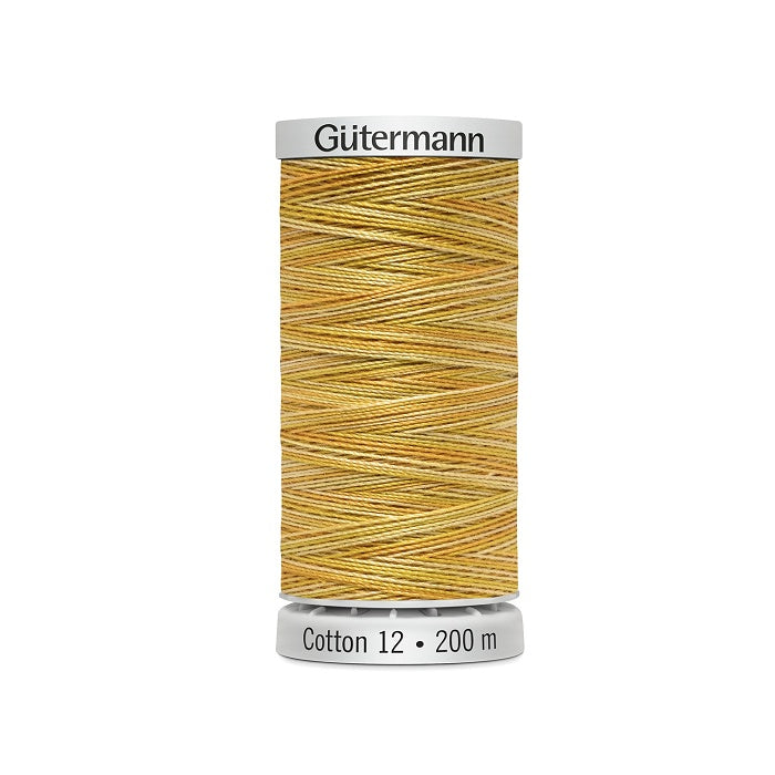 Spool of yellow variegated thread with Gutermann Cotton 12 branding.