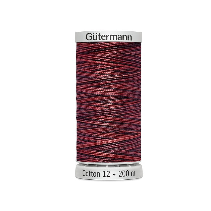 Spool of red variegated thread with Gutermann Cotton 12 branding.