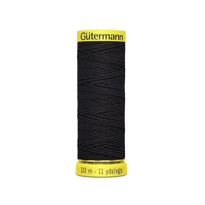 Navy elastic sewing thread spool with gutermann branding.