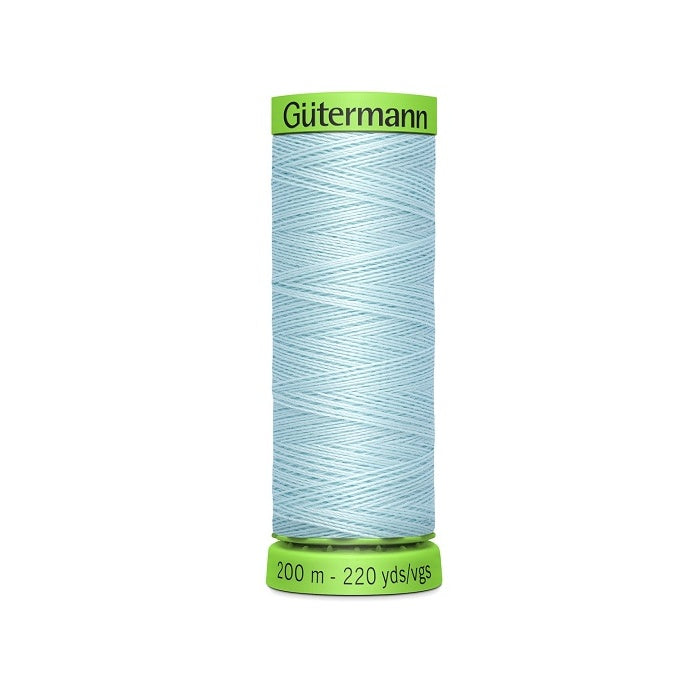 Spool of light blue extra fine thread with Gutermann branding.