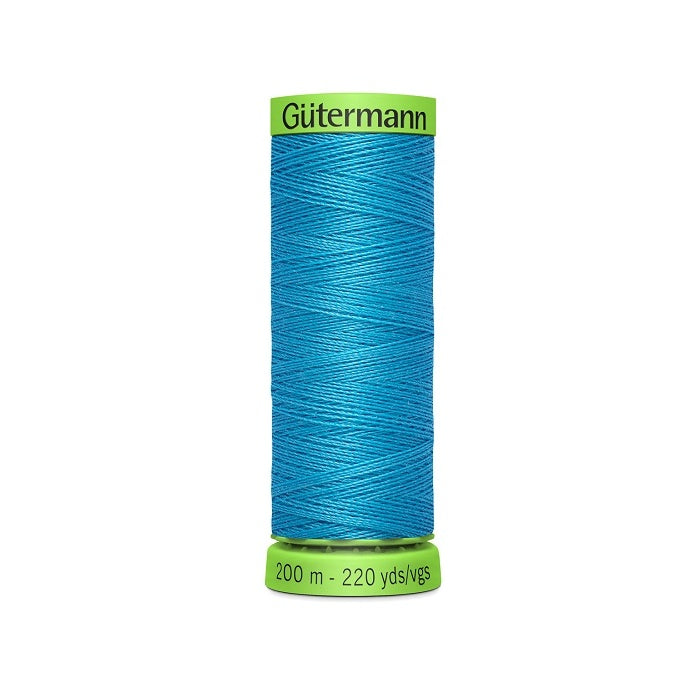 Spool of blue extra fine thread with Gutermann branding.