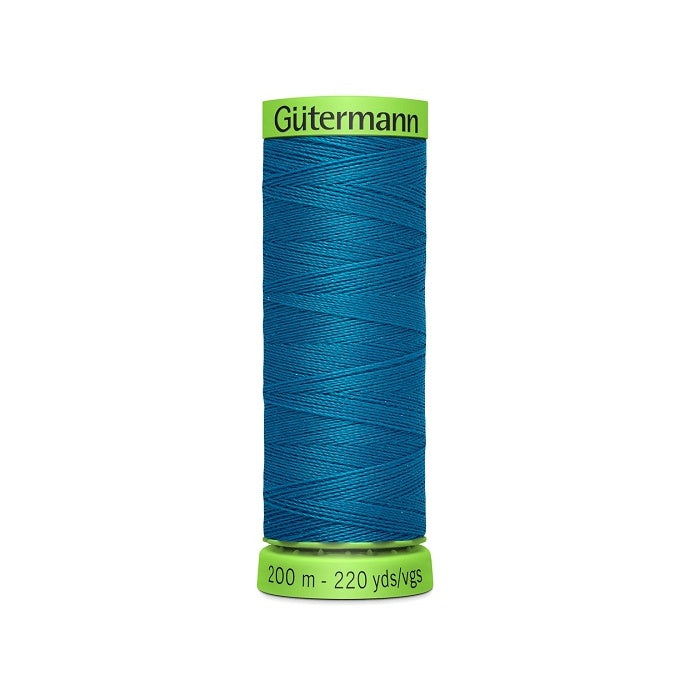 Spool of blue extra fine thread with Gutermann branding.