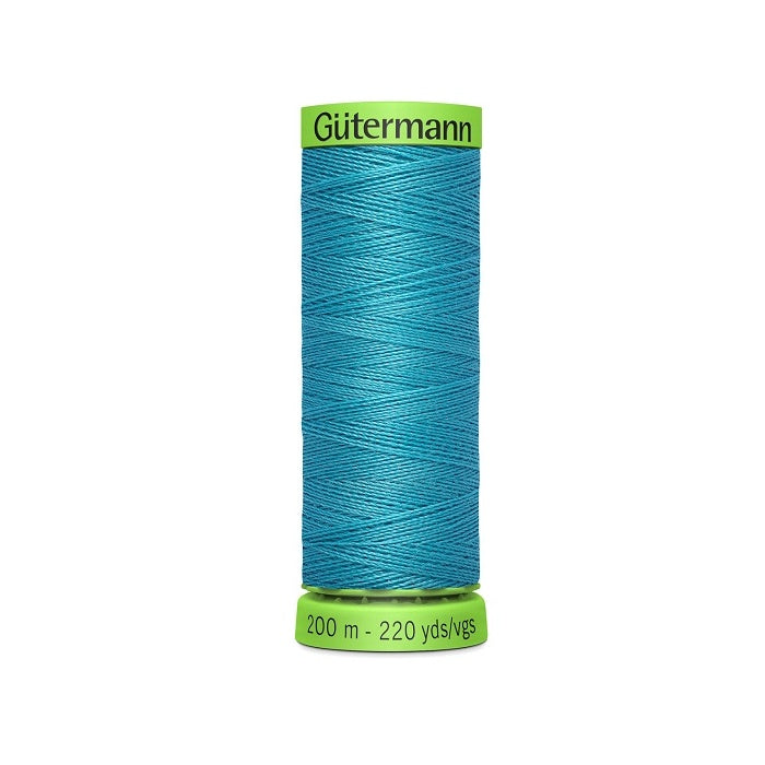 Spool of blue extra fine thread with Gutermann branding.