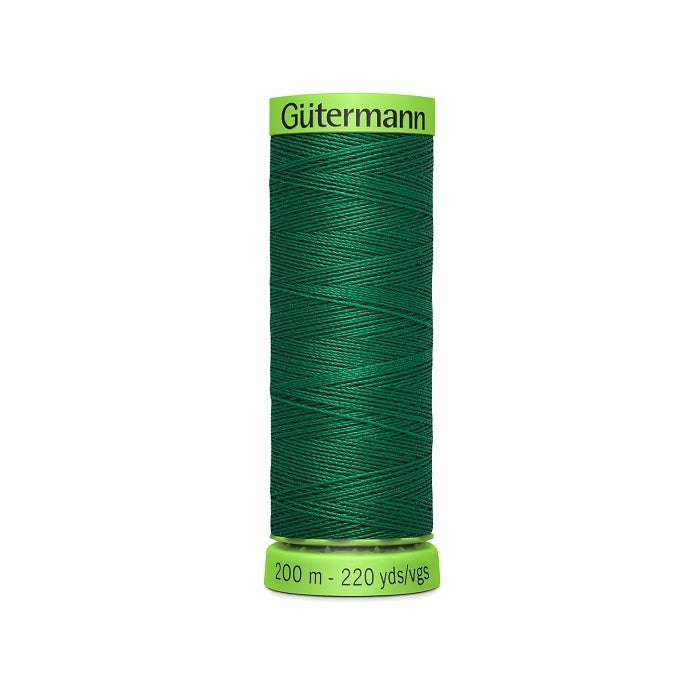 Spool of dark green extra fine thread with Gutermann branding.