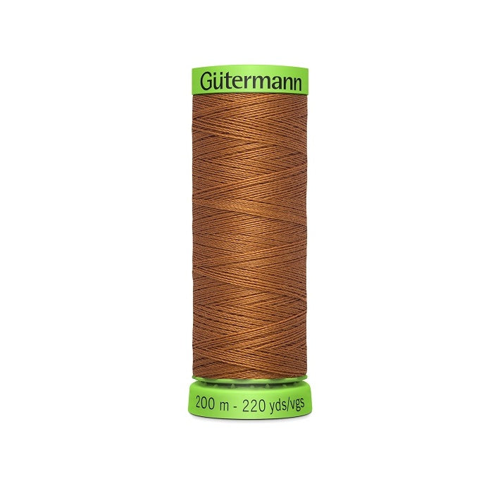 Spool of brown extra fine thread with Gutermann branding.