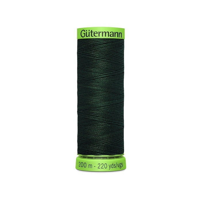 Spool of dark green extra fine thread with Gutermann branding.
