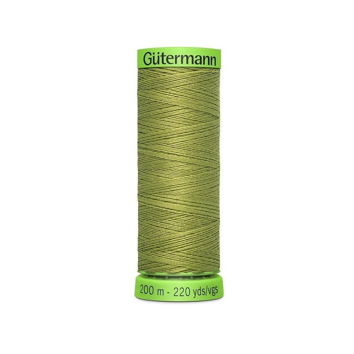 Spool of khaki green extra fine thread with Gutermann branding.