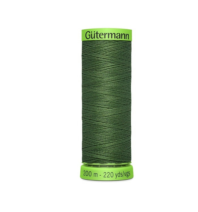 Spool of dark olive green extra fine thread with Gutermann branding.