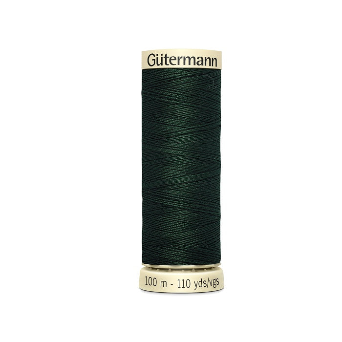 Spool of dark green thread with Gutermann branding.