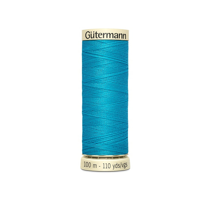Spool of blue thread with Gutermann branding.