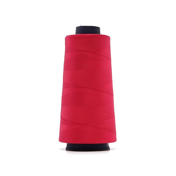 Hot pink overlocking thread cone.