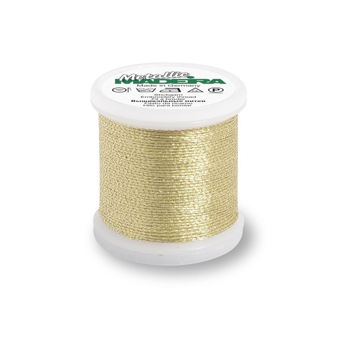 Spool of gold thread with Madeira branding.