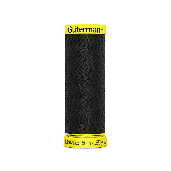 Spool of black elastic thread with gutermann branding.