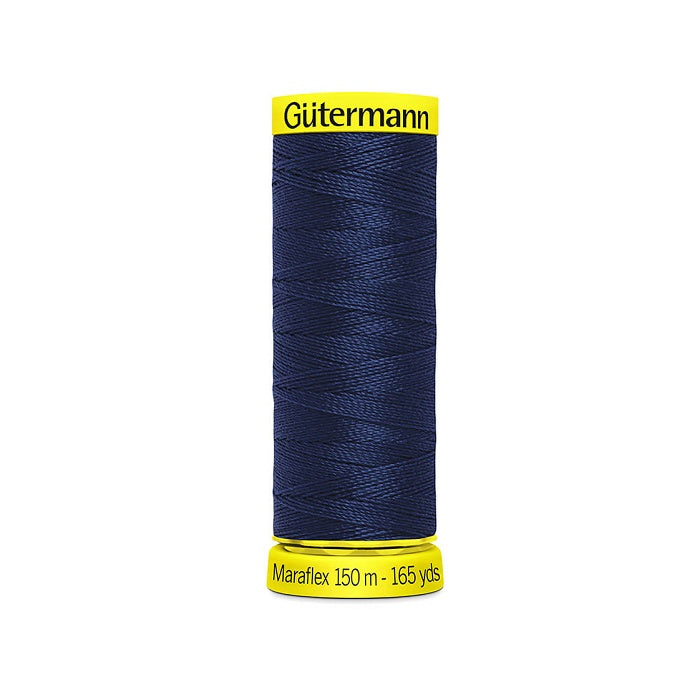 Spool of navy elastic thread with gutermann branding.