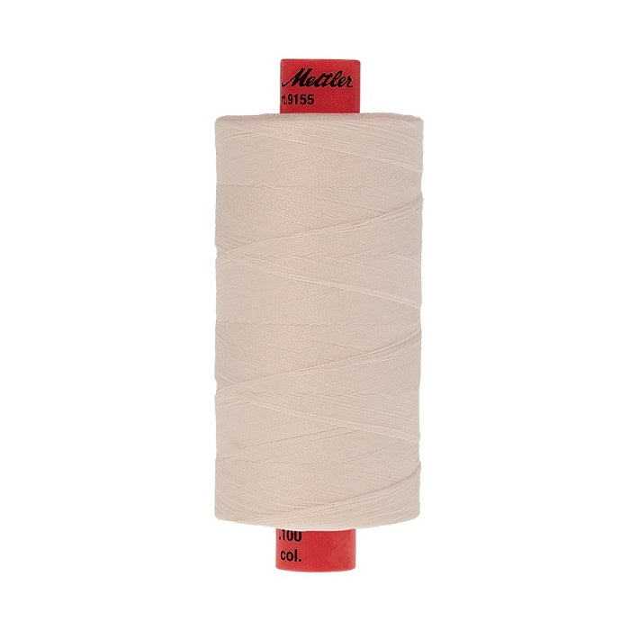 Spool of Mettler 1000m beige thread.