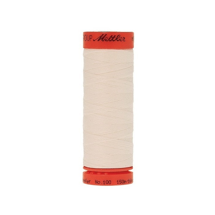Spool of Mettler 150m eggshell white thread.