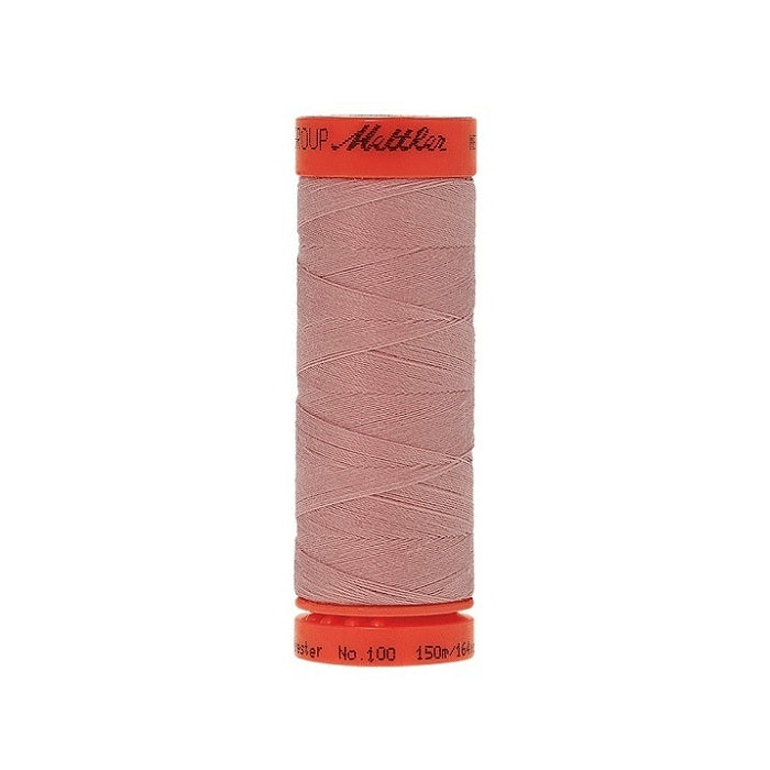 Spool of Mettler 150m pink thread.