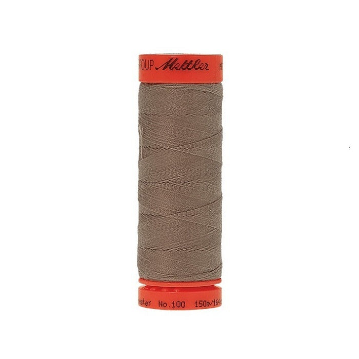 Spool of Mettler 150m light brown thread.