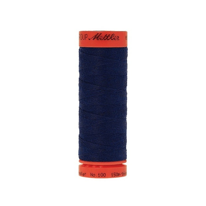 Spool of Mettler 150m dark blue thread.