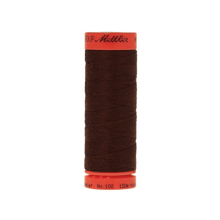Spool of Mettler 150m dark brown thread.