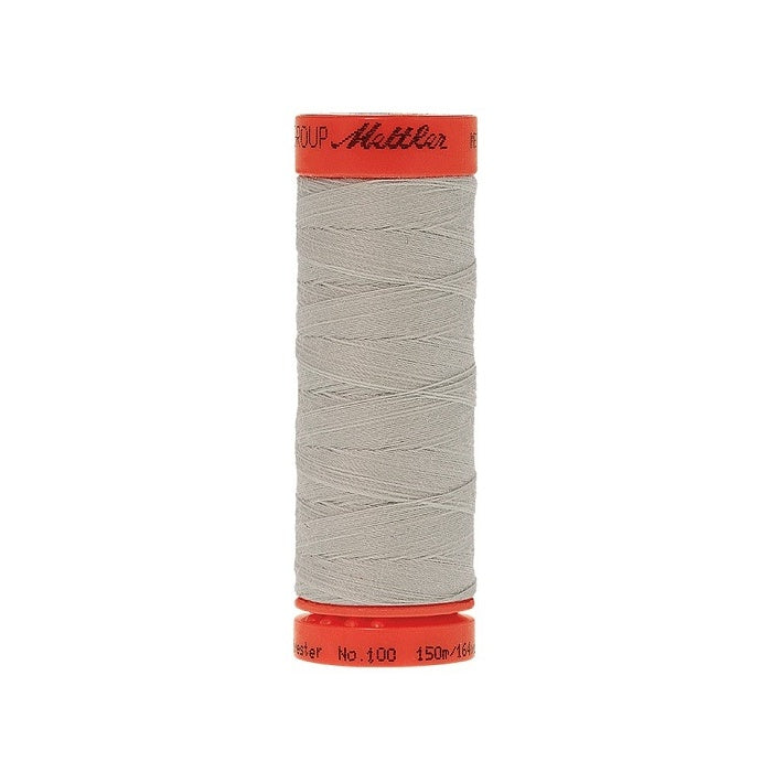 Spool of Mettler 150m light grey thread.