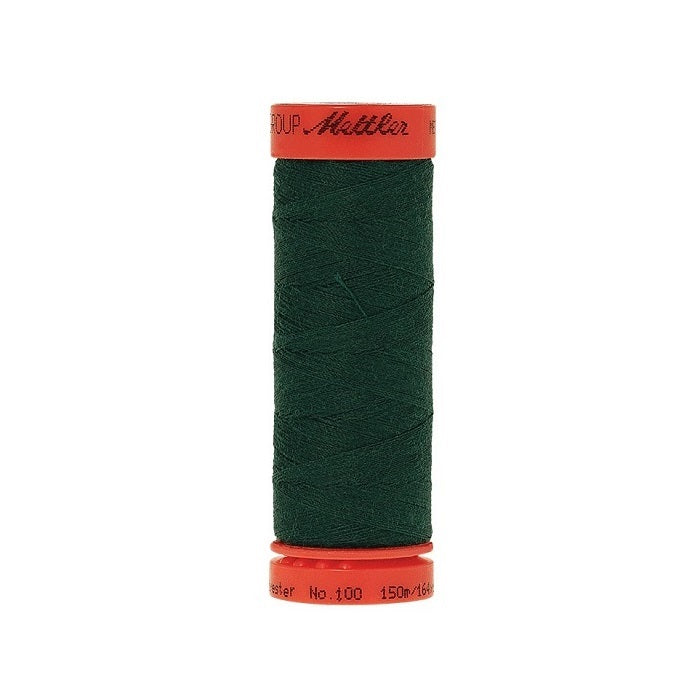 Spool of Mettler 150m dark green thread.