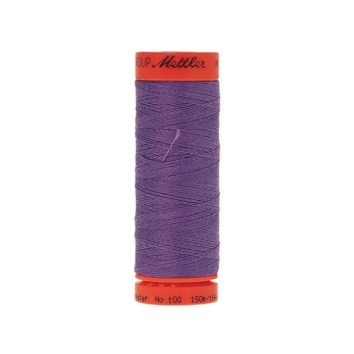 Spool of Mettler 150m dark lavender thread.