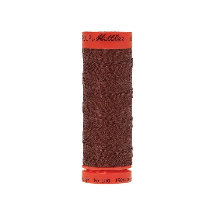 Spool of Mettler 150m dark brown thread.
