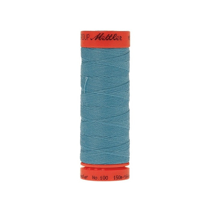 Spool of Mettler 150m turquoise blue thread.
