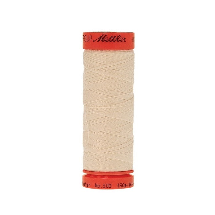 Spool of Mettler 150m light beige thread.