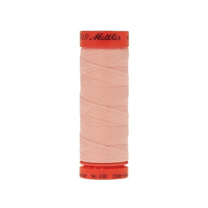 Spool of Mettler 150m pink thread.