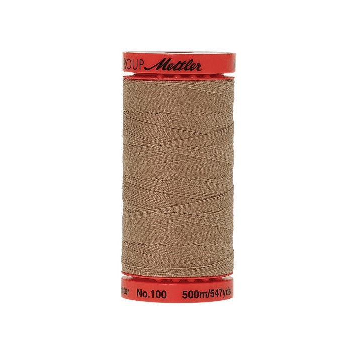 Spool of Mettler 500m light brown thread.