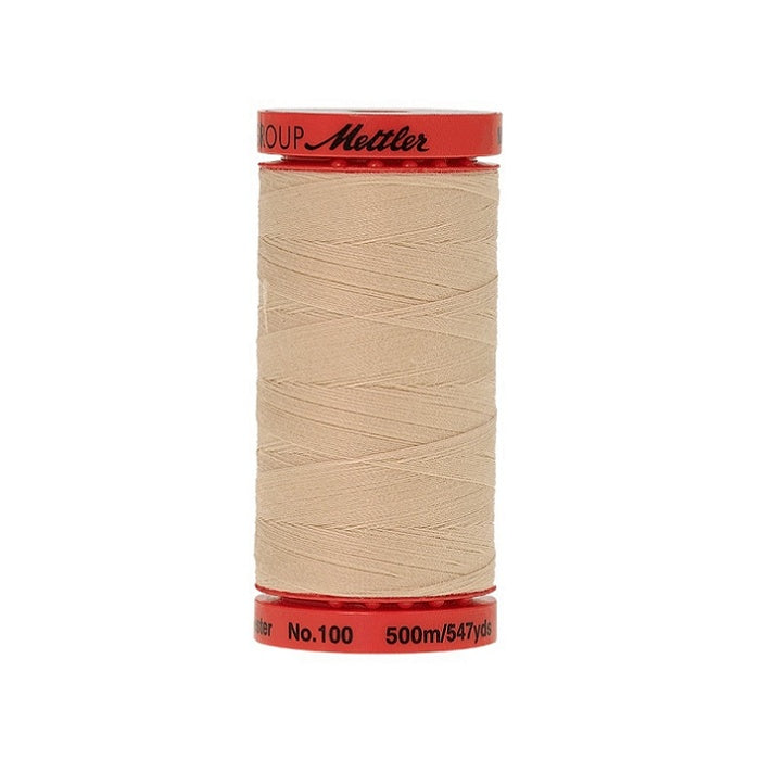 Spool of Mettler 500m beige thread.