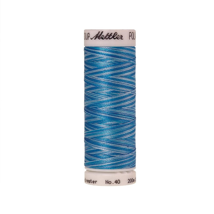 Spool of Mettler blue variegated thread.