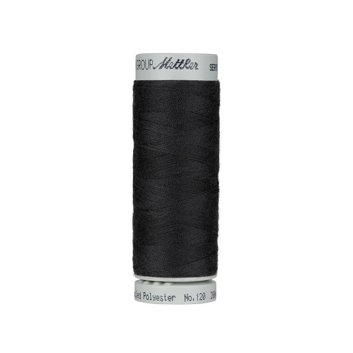 Spool of very dark grey thread with Mettler Seracycle branding.