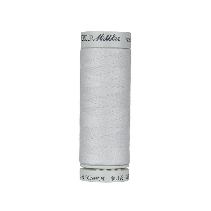 Spool of silver grey thread with Mettler Seracycle branding.