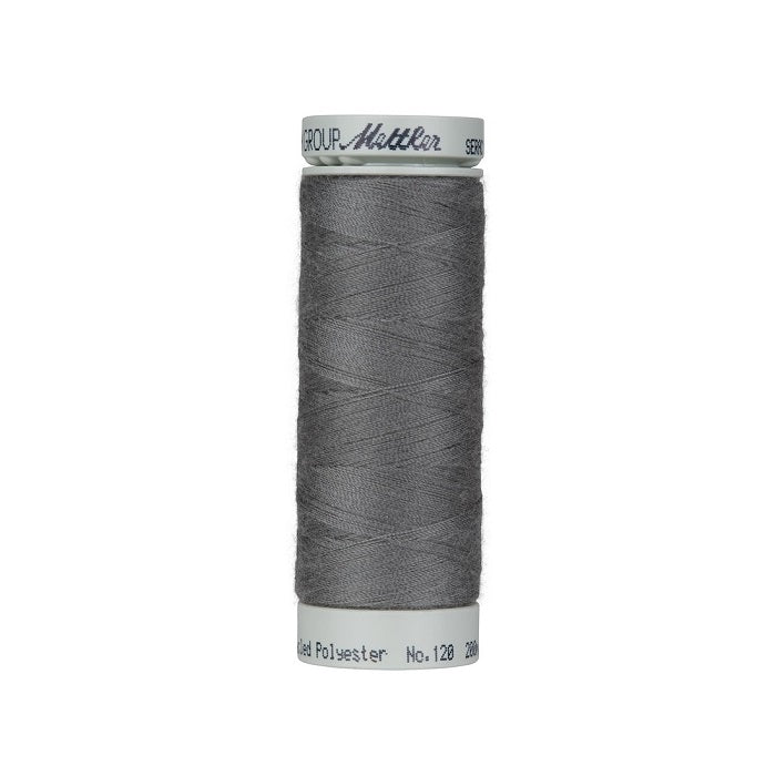 Spool of dark siilver grey thread with Mettler Seracycle branding.
