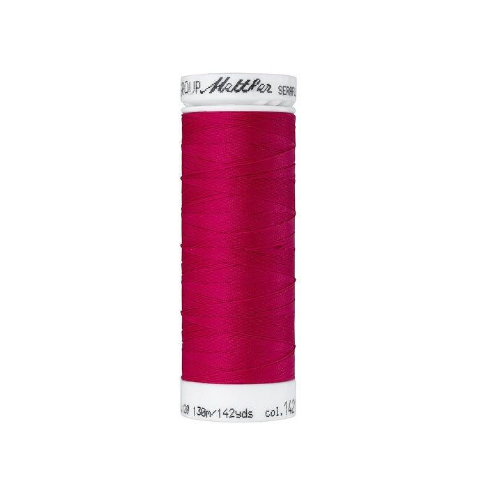 Spool of dark pink thread with Mettler Seraflex branding.