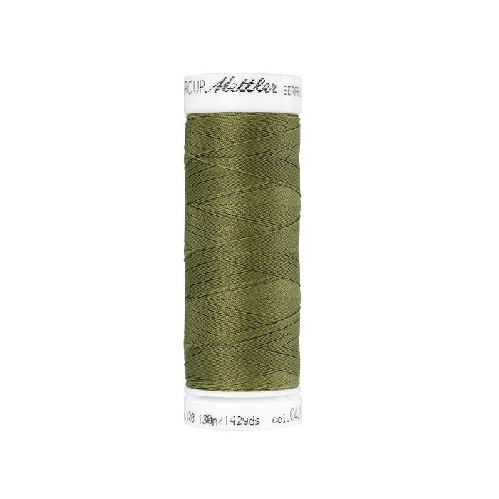 Spool of olive green thread with Mettler Seraflex branding.