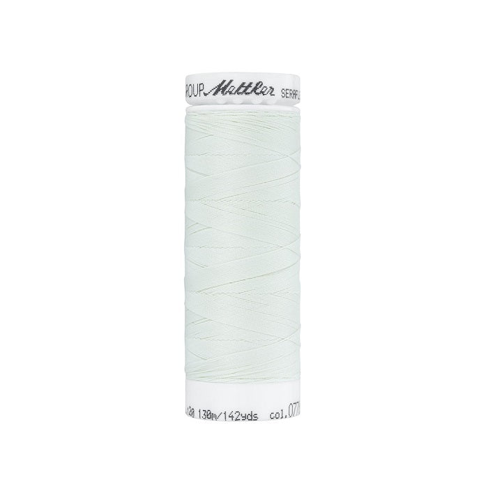 Spool of very pale blue thread with Mettler Seraflex branding.